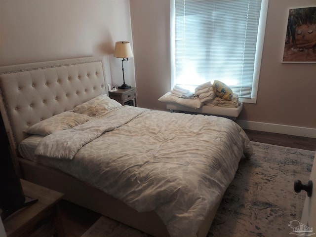 bedroom featuring dark hardwood / wood-style floors