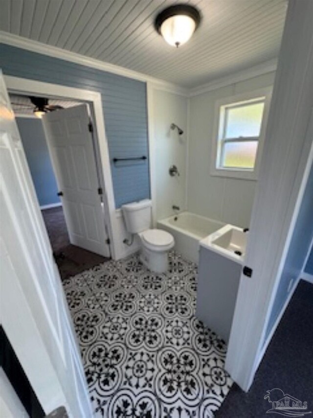 bathroom featuring shower / tub combination, crown molding, tile patterned flooring, and toilet