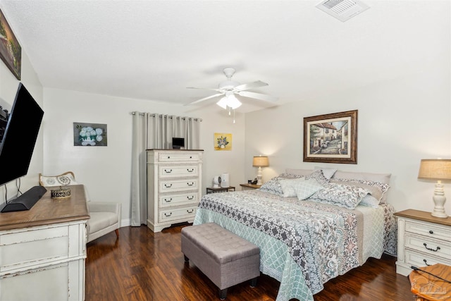 bedroom featuring ceiling fan and dark wood-type flooring