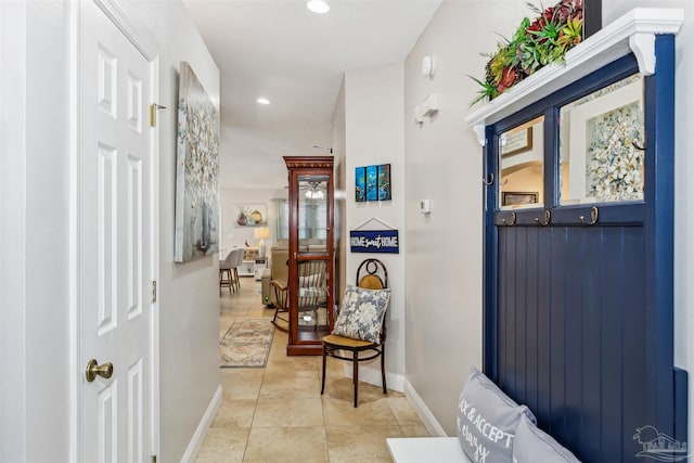 hallway with light tile patterned floors