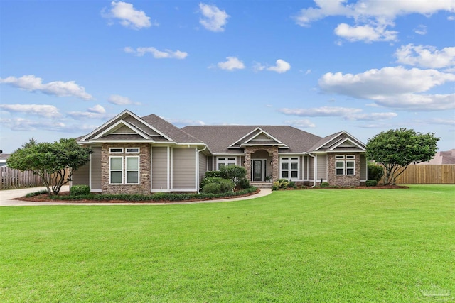 4121 Castle Gate Dr, Pace, FL 32571 - craftsman inspired home with stone siding and roof with shingles