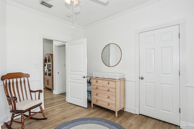 4121 Castle Gate Dr, Pace, FL 32571 - sitting room with ornamental molding, ceiling fan, wood finished floors, and baseboards