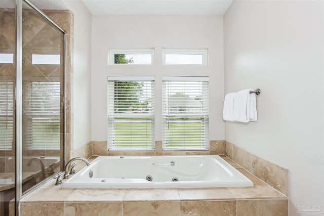 4121 Castle Gate Dr, Pace, FL 32571 - full bathroom featuring plenty of natural light, a jetted tub, and a stall shower