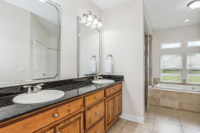 4121 Castle Gate Dr, Pace, FL 32571 - full bath featuring double vanity, a bath, tile patterned floors, a stall shower, and baseboards