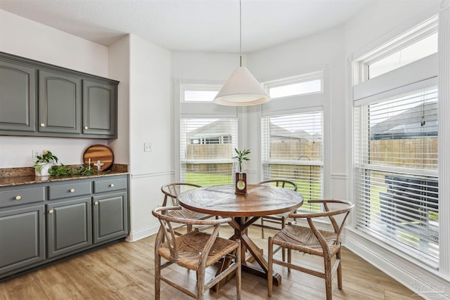 4121 Castle Gate Dr, Pace, FL 32571 - dining room with light wood-style floors and baseboards