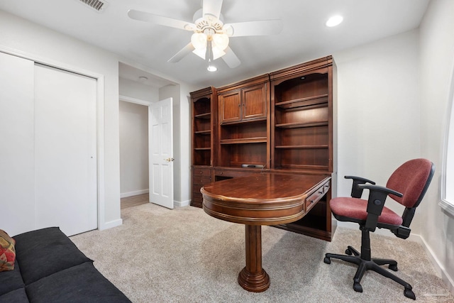 office featuring ceiling fan and light colored carpet