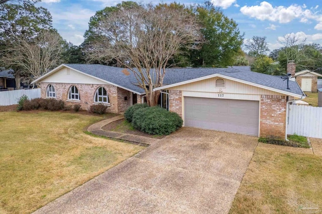 ranch-style house with a front yard and a garage