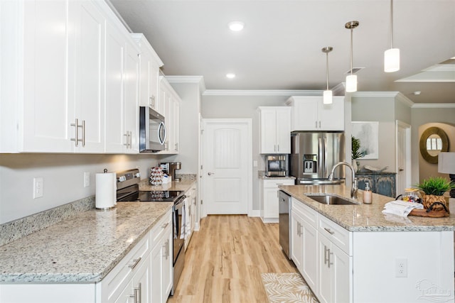 kitchen featuring white cabinets, light wood-type flooring, ornamental molding, decorative light fixtures, and stainless steel appliances