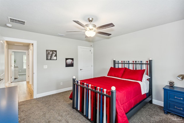 carpeted bedroom with ceiling fan