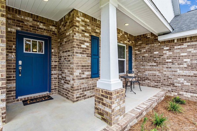 property entrance featuring covered porch