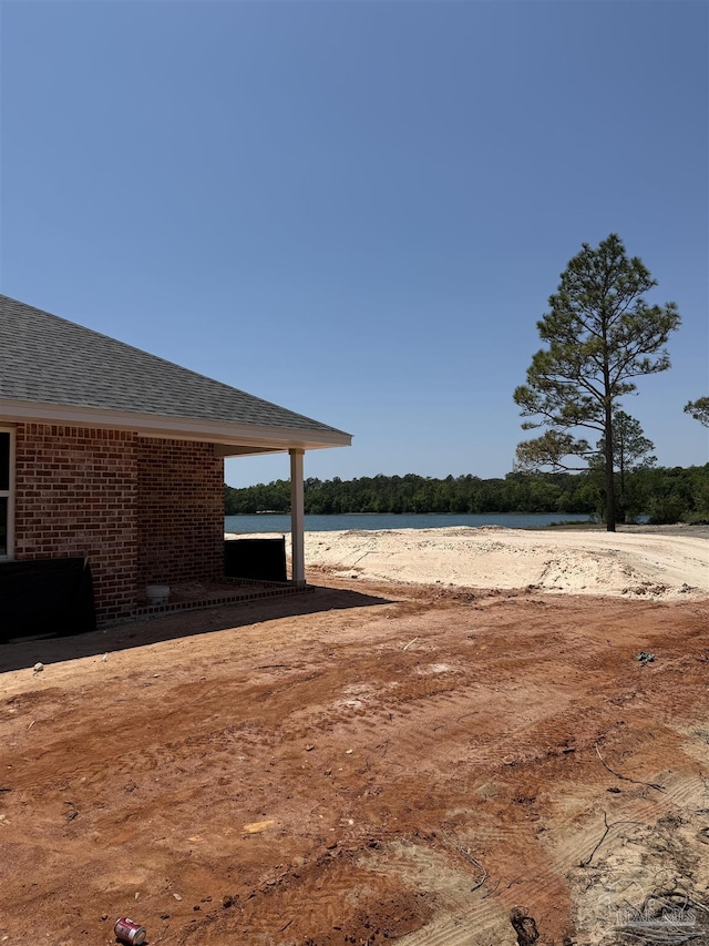 view of yard with a water view