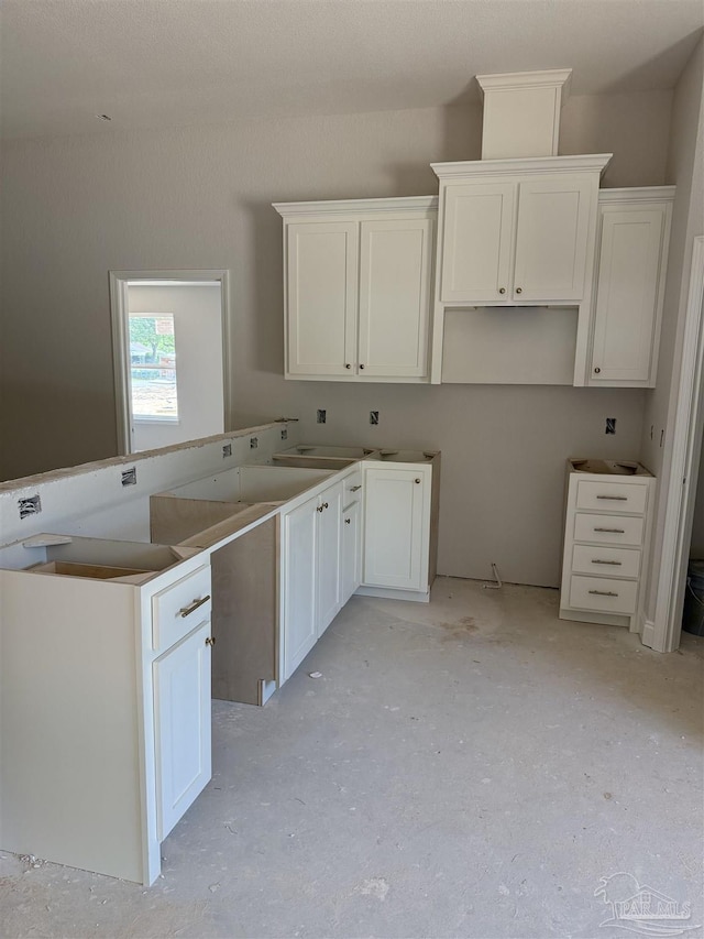 kitchen featuring white cabinets
