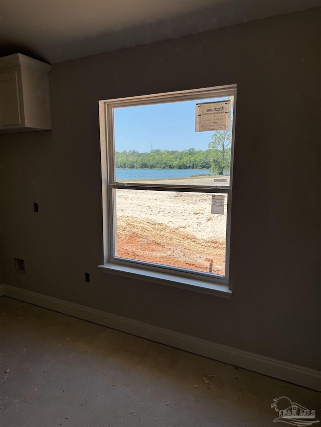 interior space featuring baseboards