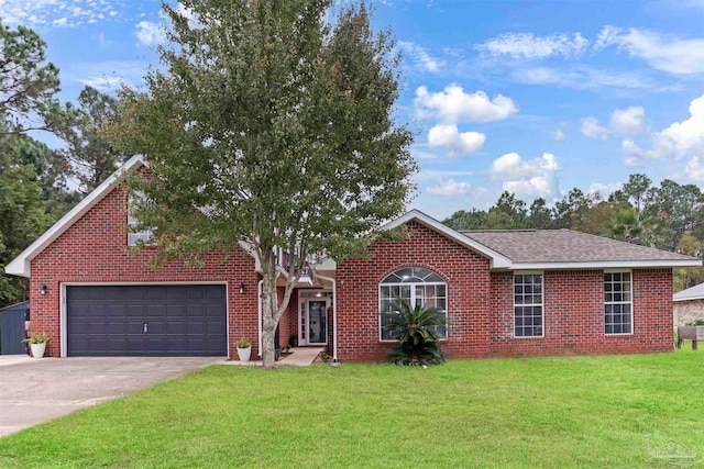 view of front of house with a front lawn and a garage