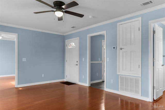 spare room with hardwood / wood-style floors, ceiling fan, crown molding, and a textured ceiling