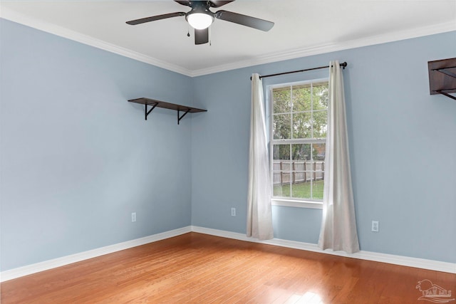 spare room featuring wood-type flooring, ceiling fan, and ornamental molding