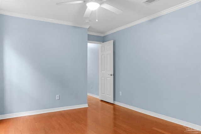 unfurnished room featuring hardwood / wood-style floors, ceiling fan, and ornamental molding