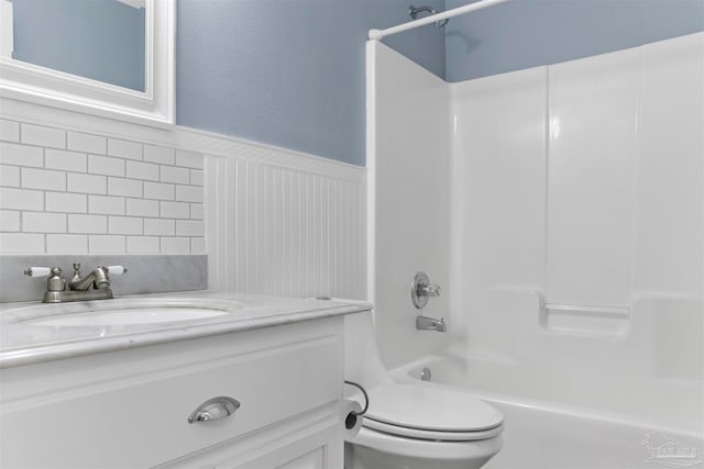 full bathroom featuring shower / bathing tub combination, vanity, and toilet