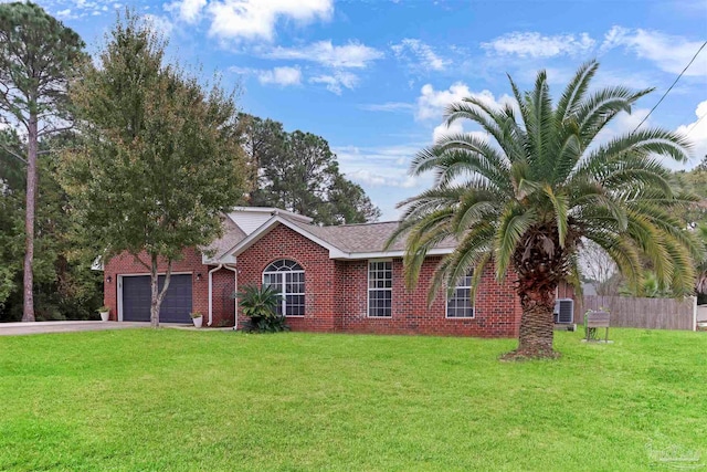 view of front of home featuring a front yard and a garage