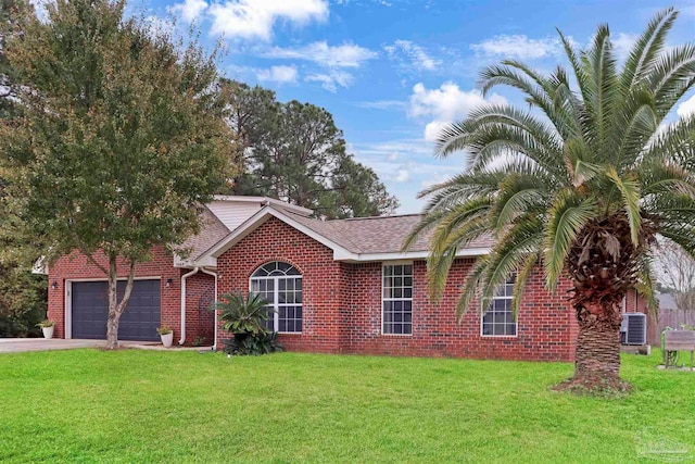 view of front of house with central air condition unit, a front lawn, and a garage