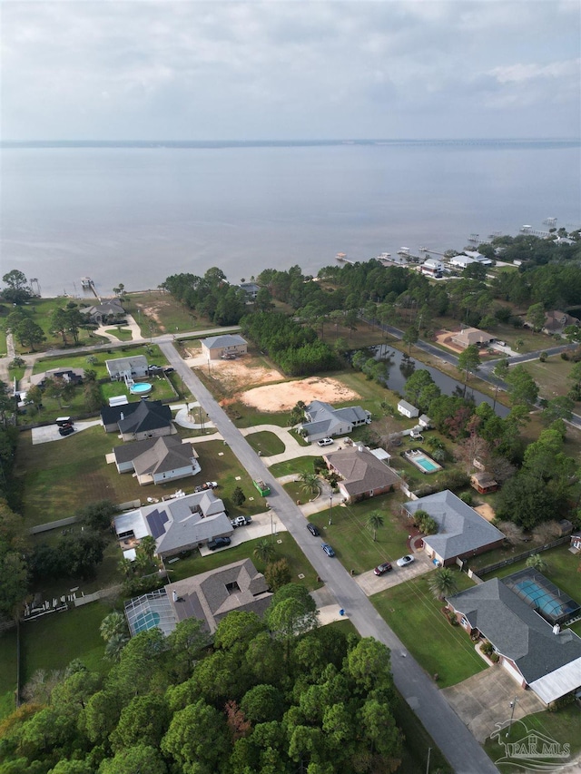 birds eye view of property featuring a water view