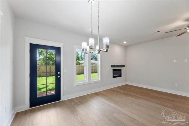 kitchen featuring white cabinetry, ceiling fan with notable chandelier, light wood-type flooring, sink, and dishwasher