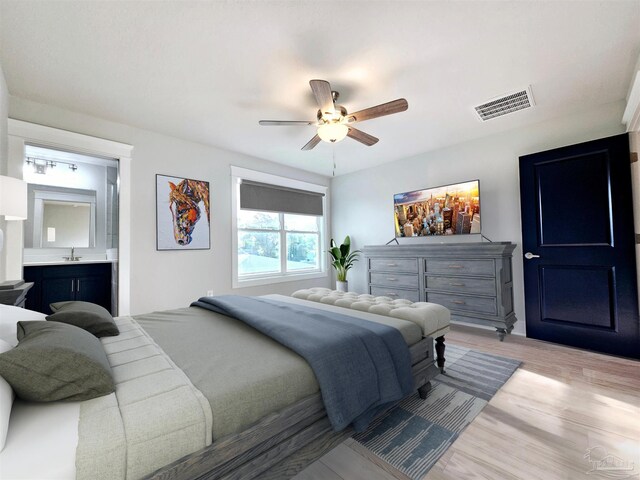 bedroom featuring light hardwood / wood-style floors and ceiling fan