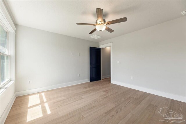 spare room featuring ceiling fan and light wood-type flooring