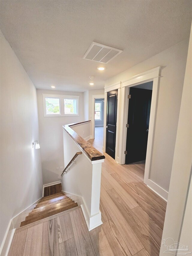 staircase with light wood-type flooring