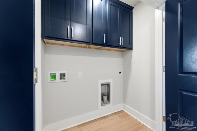 laundry room with washer hookup, hookup for an electric dryer, light hardwood / wood-style flooring, and cabinets