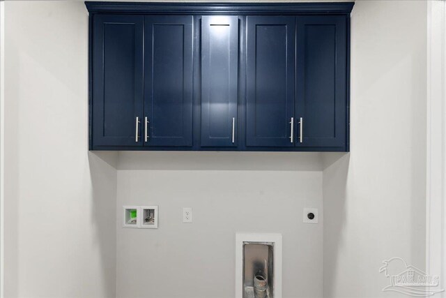 laundry room featuring cabinets, hookup for an electric dryer, and washer hookup