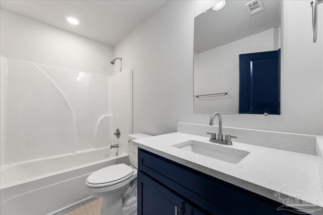 full bathroom with shower / washtub combination, vanity, tile patterned floors, and toilet