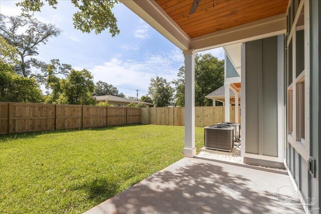 view of yard featuring a patio and central AC