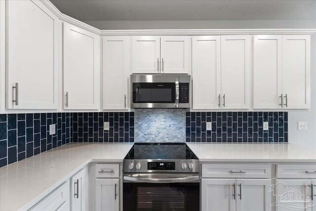 kitchen featuring white cabinets, light wood-type flooring, sink, dishwasher, and a kitchen island with sink