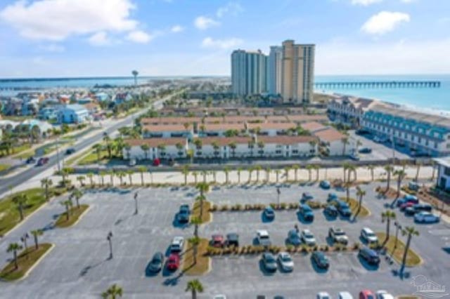 drone / aerial view featuring a water view and a city view