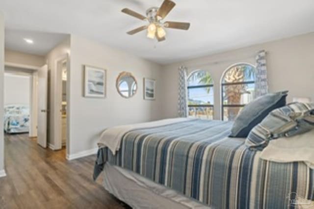 bedroom with wood finished floors, ceiling fan, and baseboards