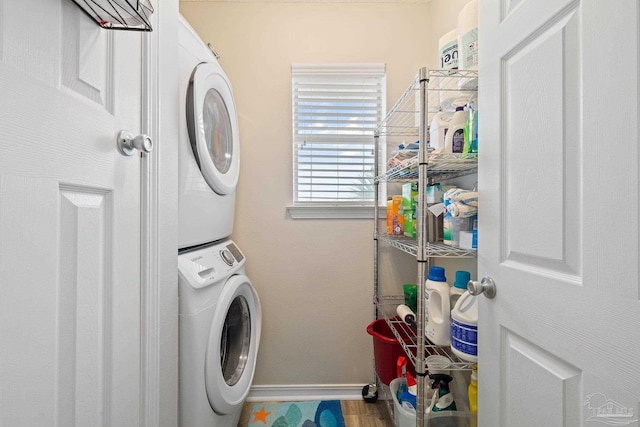 7464 Sunset Harbor Dr Unit 133, Navarre Beach, FL 32566 - washroom featuring stacked washer / dryer
