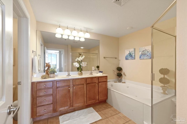 bathroom with independent shower and bath, tile patterned floors, and vanity