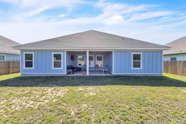1346 Sea Grove Ct, Gulf Breeze, FL 32563 - back of property with board and batten siding, a patio, and roof with shingles