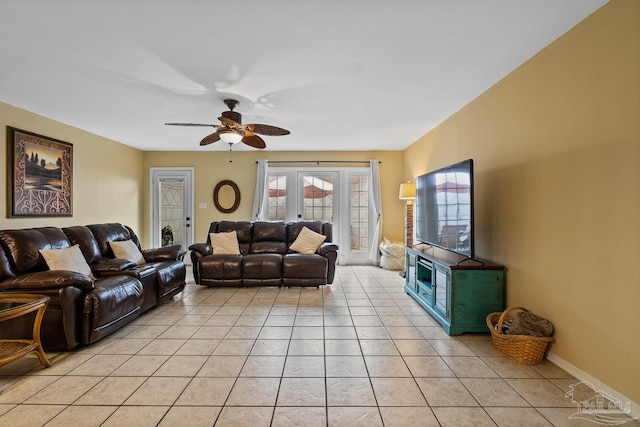 living room featuring ceiling fan and light tile patterned floors