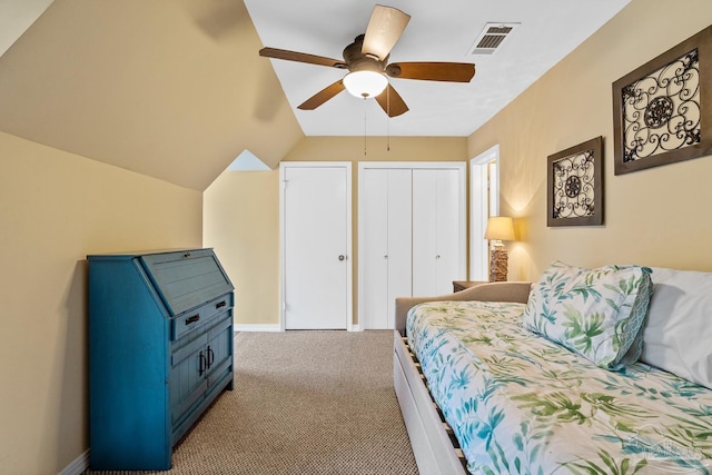 bedroom featuring light carpet, lofted ceiling, and ceiling fan