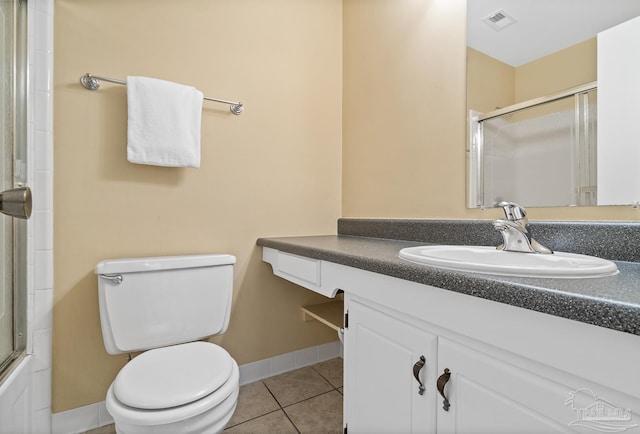 full bathroom with vanity, tile patterned floors, enclosed tub / shower combo, and toilet