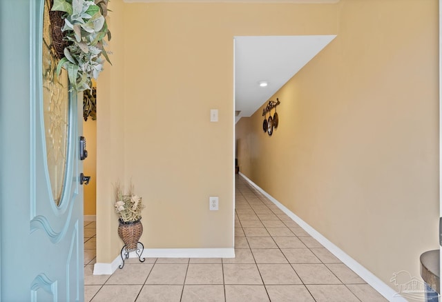 entryway with light tile patterned flooring