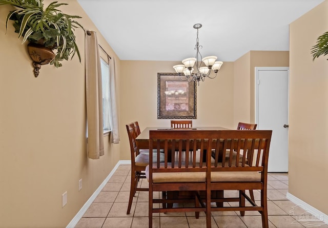 dining room featuring a notable chandelier and light tile patterned floors