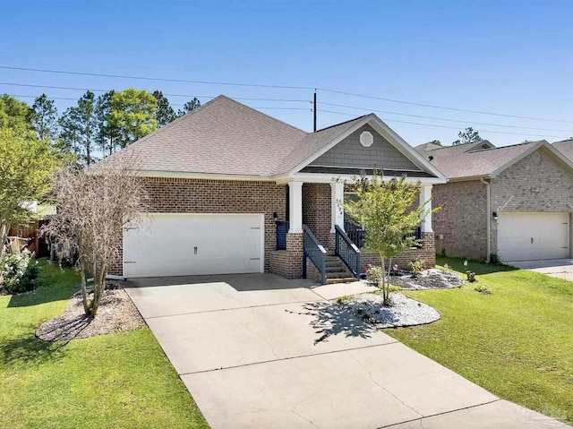 3594 Whitetail Ln, Pensacola, FL 32526 - craftsman-style house featuring brick siding, an attached garage, driveway, and a front lawn