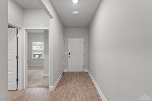 3594 Whitetail Ln, Pensacola, FL 32526 - hallway featuring light wood-type flooring and baseboards