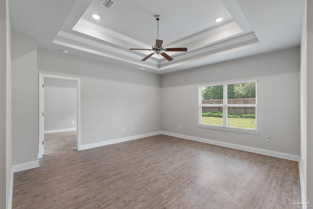 3594 Whitetail Ln, Pensacola, FL 32526 - spare room with a raised ceiling, wood finished floors, ceiling fan, crown molding, and recessed lighting