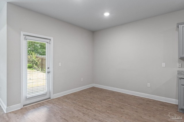 3594 Whitetail Ln, Pensacola, FL 32526 - empty room featuring light wood-style flooring and recessed lighting