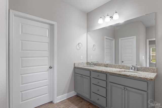 3594 Whitetail Ln, Pensacola, FL 32526 - bathroom with double vanity and wood finished floors