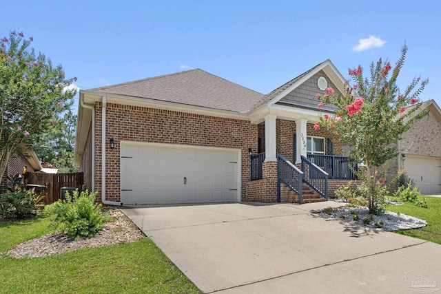 3594 Whitetail Ln, Pensacola, FL 32526 - view of front of house with a garage, concrete driveway, brick siding, and covered porch